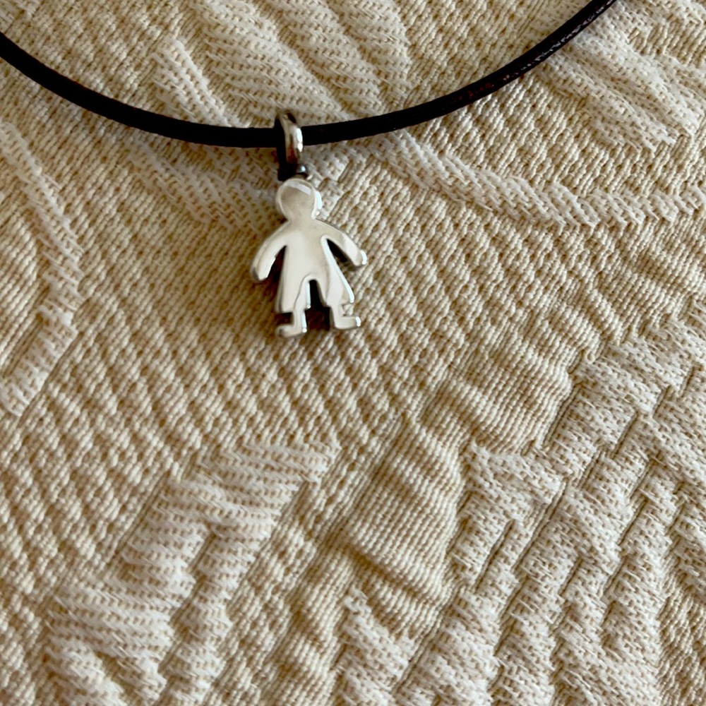 Tous silver baby boy charm on leather necklace